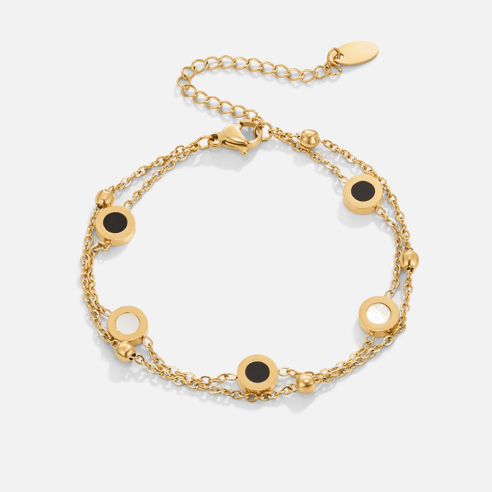 Carla – Gouden armband met zachte ronde contrasterende elementen.